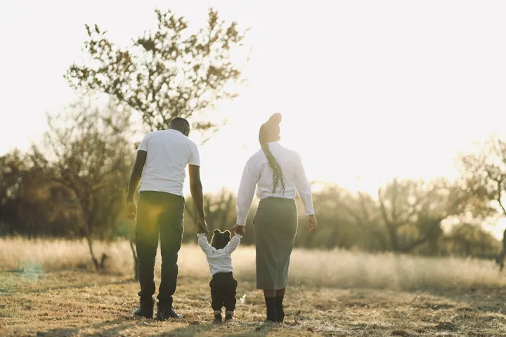 A family walking together in golden evening light